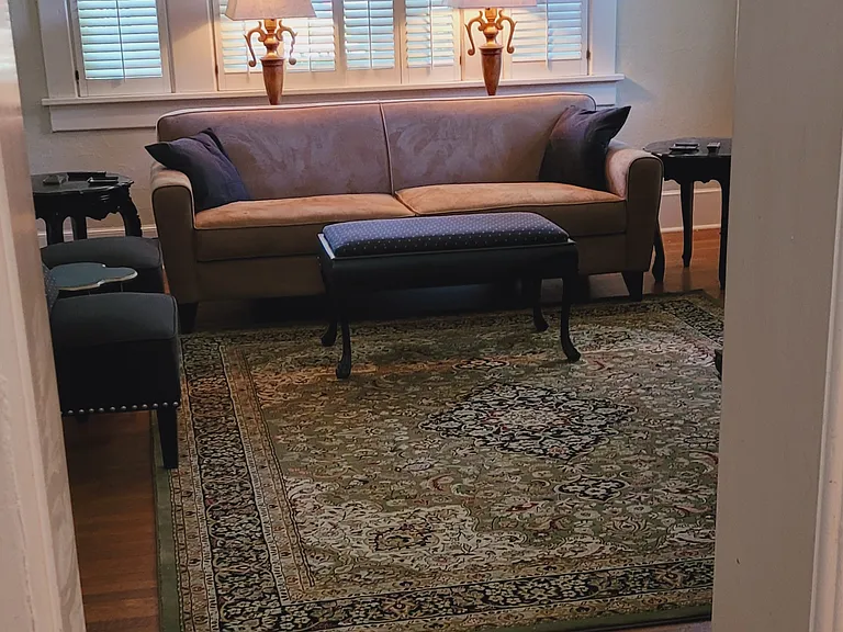 View from dining room to living room windows in front of house