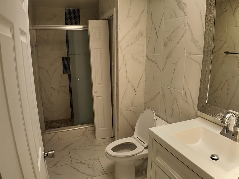 tile bathroom with walk-in shower