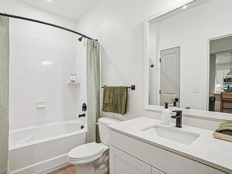 Bathroom with Quartz Countertop and Soaking Tub