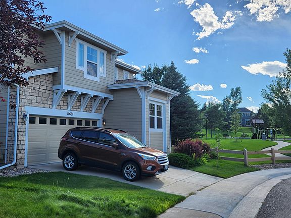 Exterior of house. Spearwood Park and the Highlands Ranch walking path directly next to the house.
