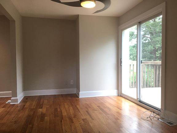 Living room with sliding glass door to deck