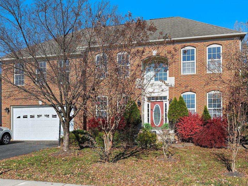 Front of the house with 2 car garage and space for 2 cars in the driveway
