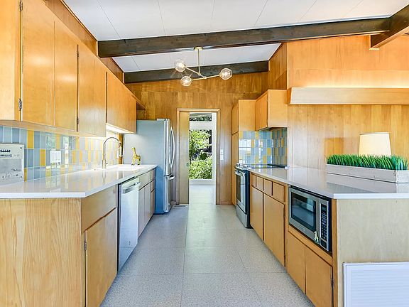 Kitchen flows into the bonus room/ office and open plan dining room with vista views of the Wild Basin