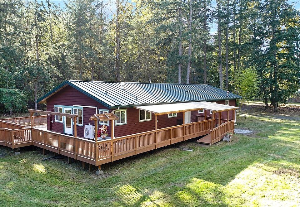 This easy-care, all-one-level home is surrounded by decks, lawn and forest. There is so much here; fenced pastures, a loafing shed, barn, chicken coop and forest trails. Note the metal roof installed in 2015. 