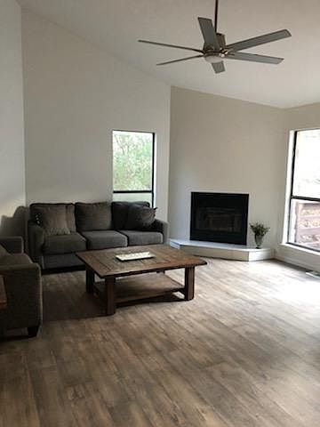 The living room has plenty of room to lounge and relax next to the fireplace or catch the latest sports highlights with cable access.