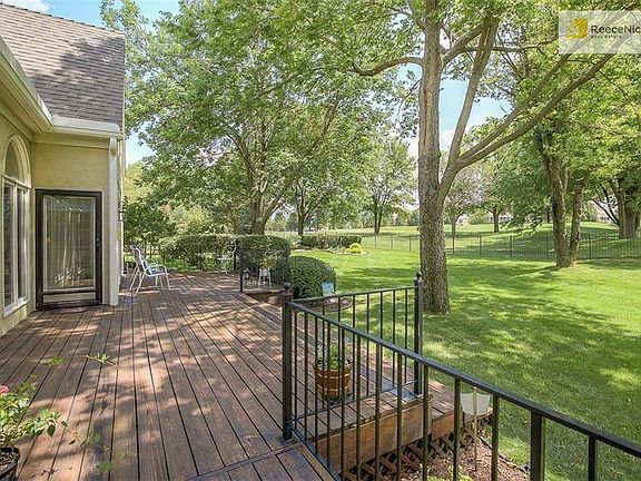 RELAX ON YOUR TREE SHADED DECK LOOKING OUT TO THE 2ND FAIRWAY