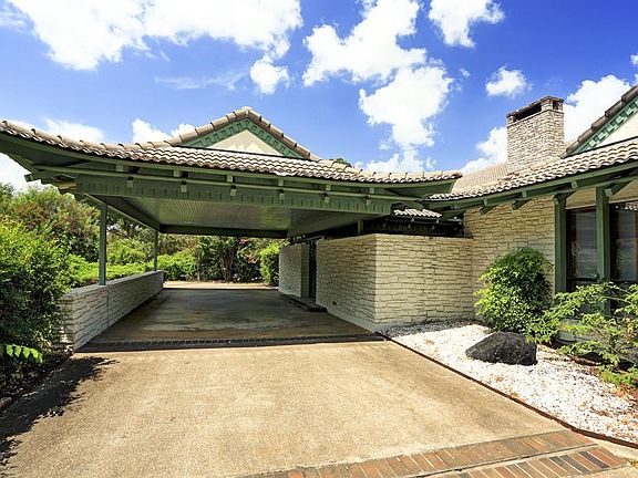 The Porte-Cochere has parking for 2
