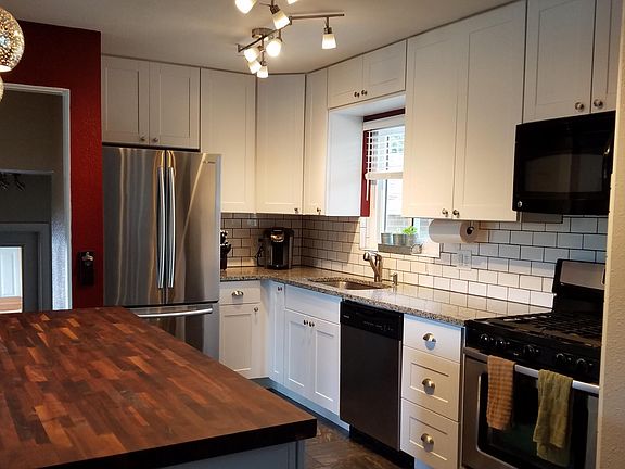 Kitchen with lots of storage, drawers, and spice rack