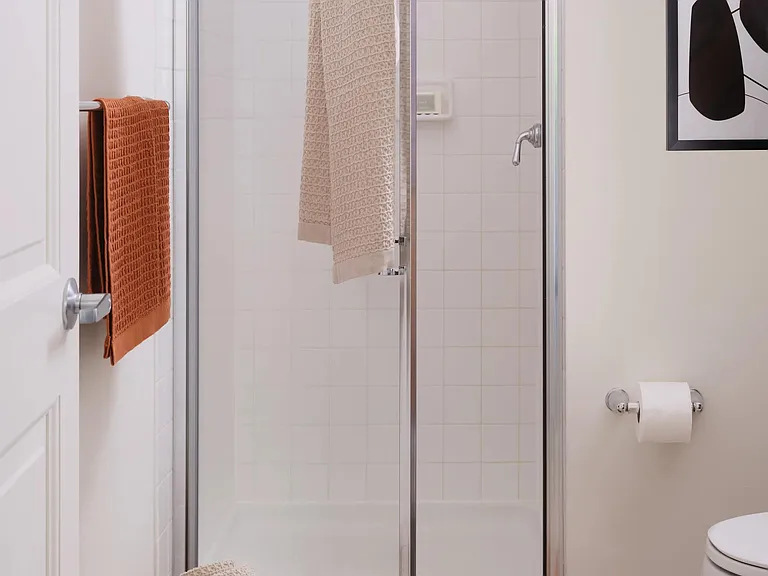 Serene bathrooms with spa-like soaking tubs or showers with tile surrounds.