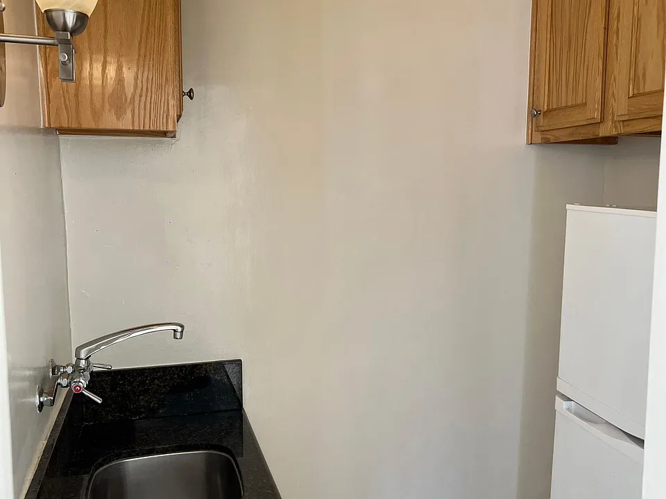Kitchenette (No Stove or Microwave) With refrigerator.