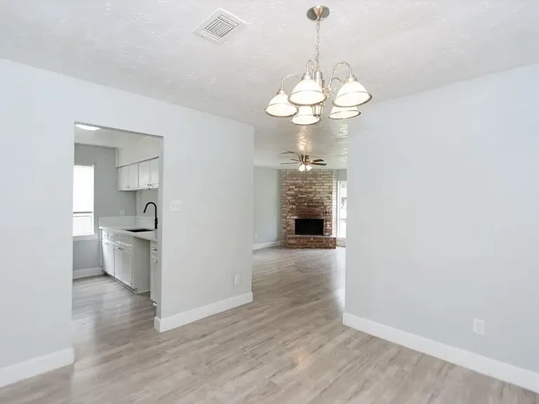 dining room looking into kitchen and living room