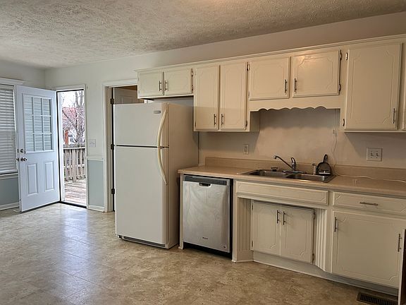 Kitchen view many cabinets
