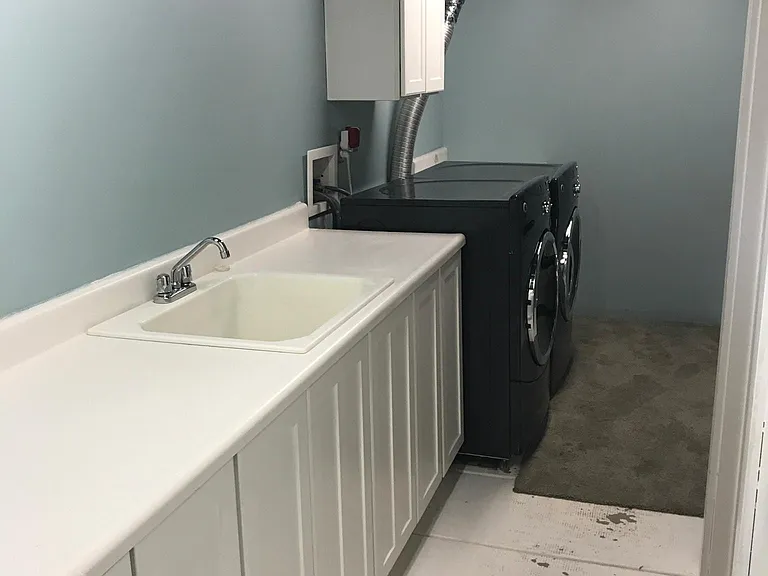 Laundry room with additional storage