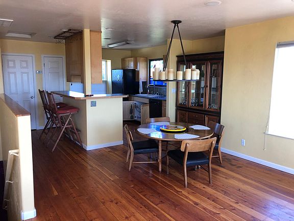 Upstairs dining table and credenza included & candle chandelier w/dimmer