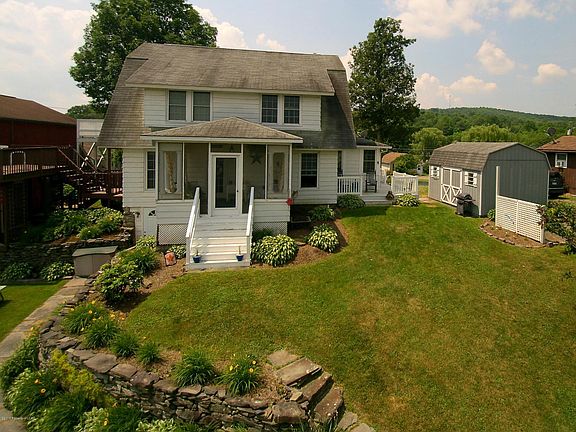 Apartment is upstairs in this white house