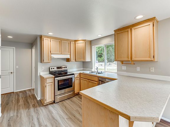 Lots of storage in this modern kitchen with an eating bar