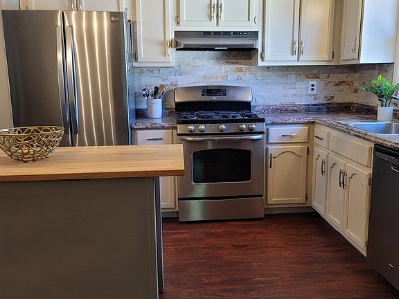 Kitchen with stainless steel appliances (& NEW fridge)