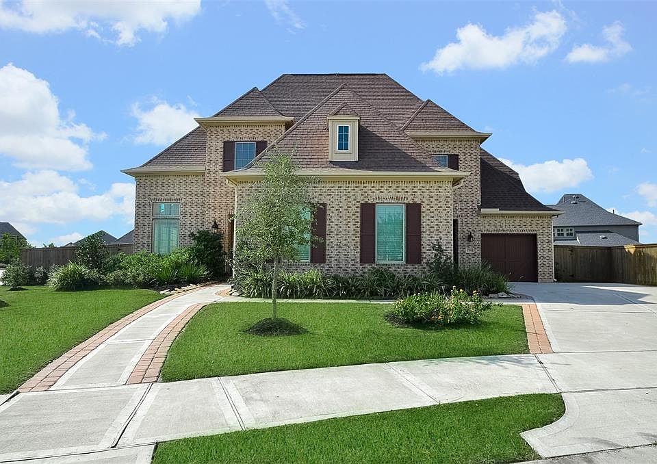 Curb appeal galore! Immaculate landscaping gives this charming home a welcoming feel from the moment you arrive.