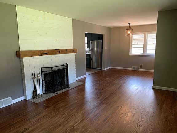 Open living room with gas log fireplace