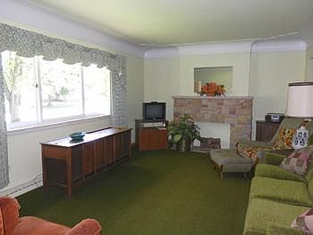 Nice clean living room with decorative fireplace