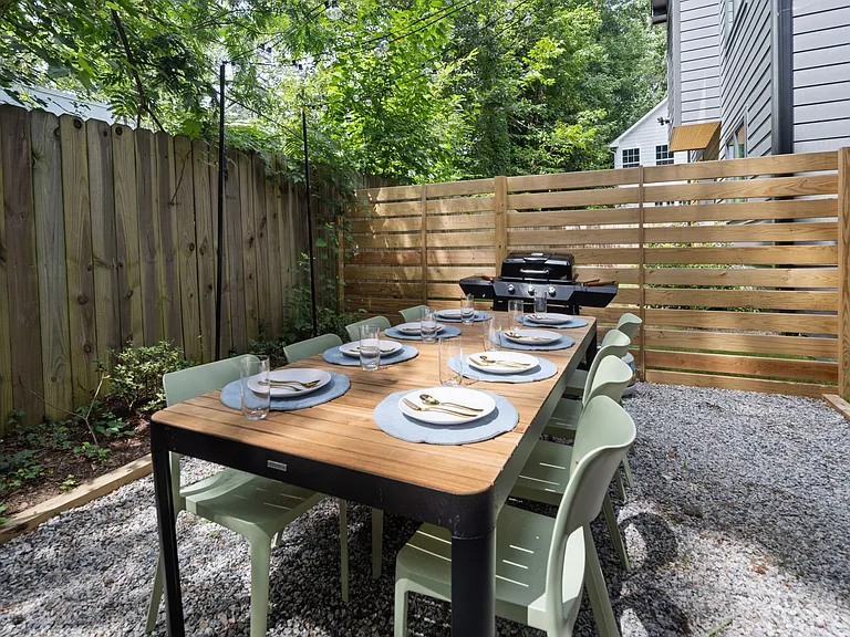 Outdoor dining space with grill