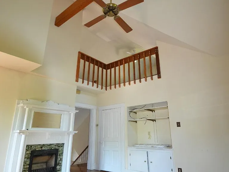Living room view with vaulted ceiling