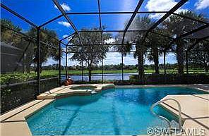 The inviting pool and spa overlook a wide lake and the 11th fair