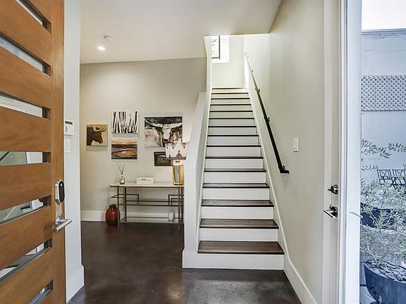 Main entrance. This property was upgraded with a side door to the pool. Easy flow without going through the secondary bedroom on the 1st floor.
