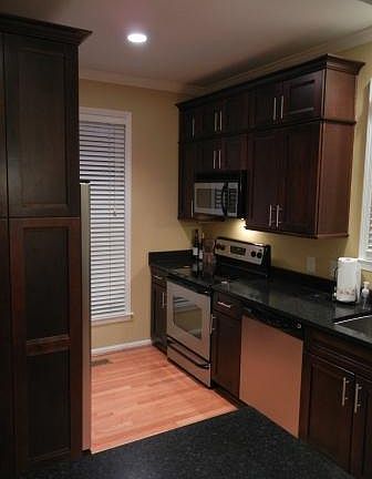 Cherry cabinets quartz tops