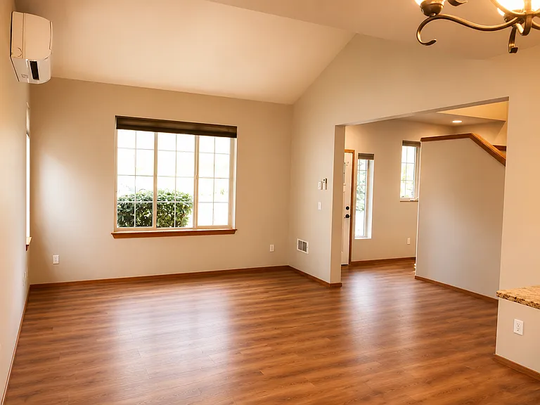 View from Dining Area onto Livingroom and Front Entry.