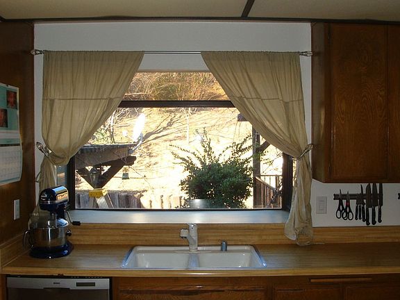 Window over sink looks to back yard