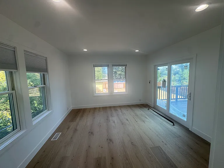 large primary suite with slider to deck and ensuite