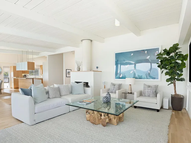 Relax in the sophisticated living space with high-end materials and designer furnishings.
