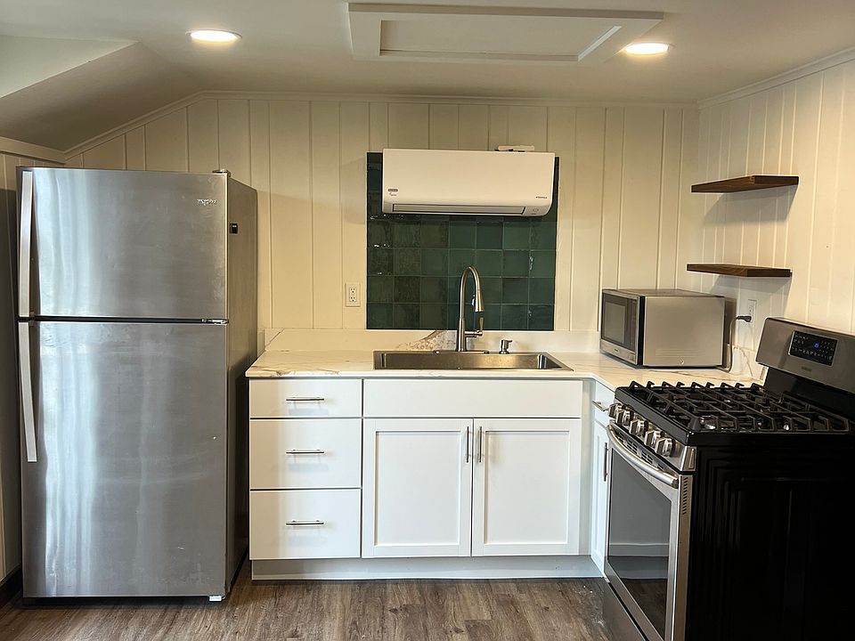 New kitchen cabinets, quartz counters. Fridge & stove are also new. New flooring.
