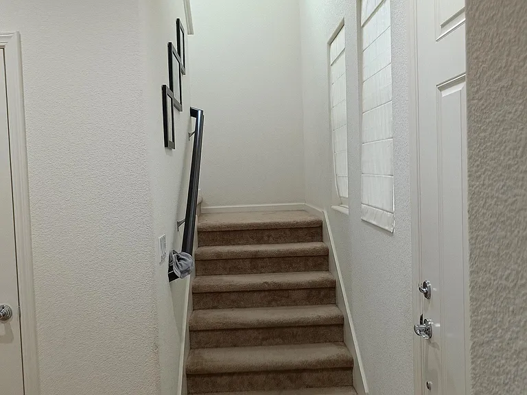 A snapshot capturing the stairs leading to the second floor.