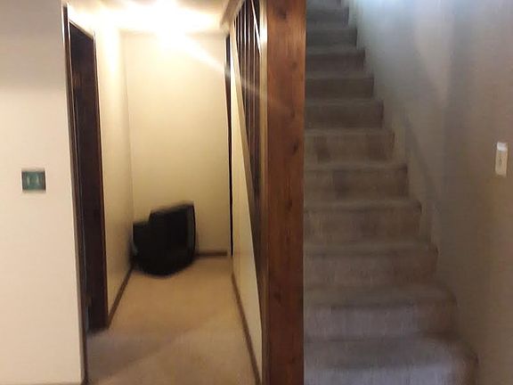 Downstairs hallway to bedroom and storage area