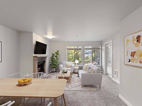 Enjoy a living room designed for both comfort and charm, with expansive windows that flood the space with natural light.