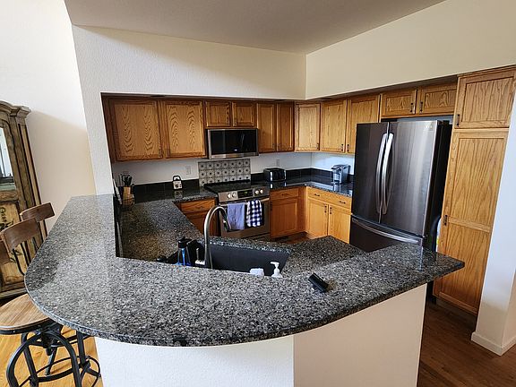 Kitchen with granite counters.