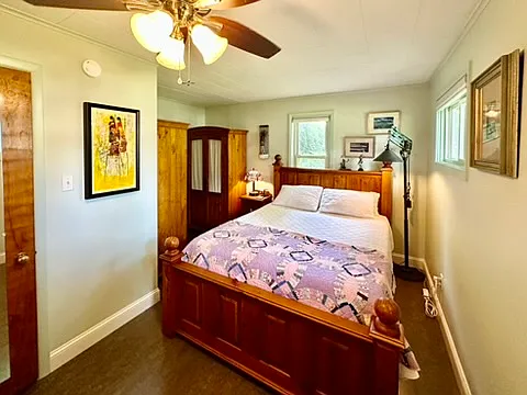 This queen bedroom features Maasai artwork from Kenya, and two pine wardrobes from Australia.