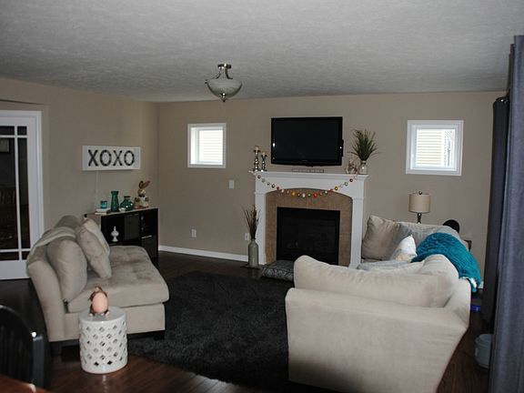 Just beyond the den is the family/living room. Surround sound wiring is all set up in this area. You'll like the gas log fireplace and easy care bamboo flooring.
