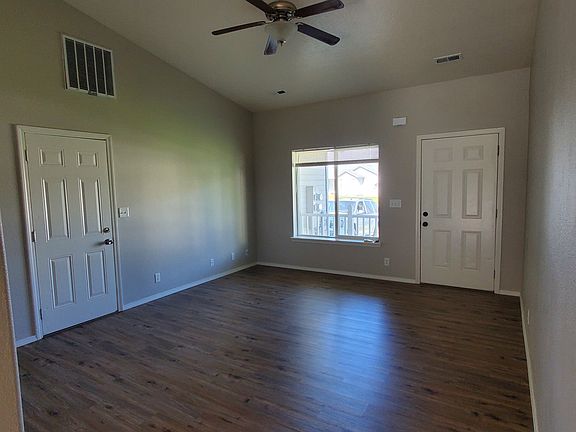 Living room. Different angle. Front door on the right, garage door on the left.