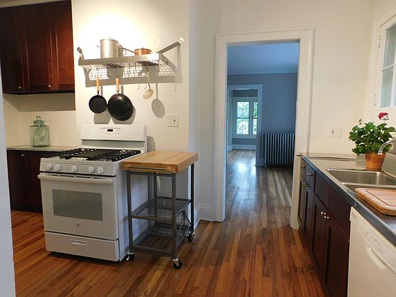 View of kitchen going into dining room. Dish washer on lower right side.