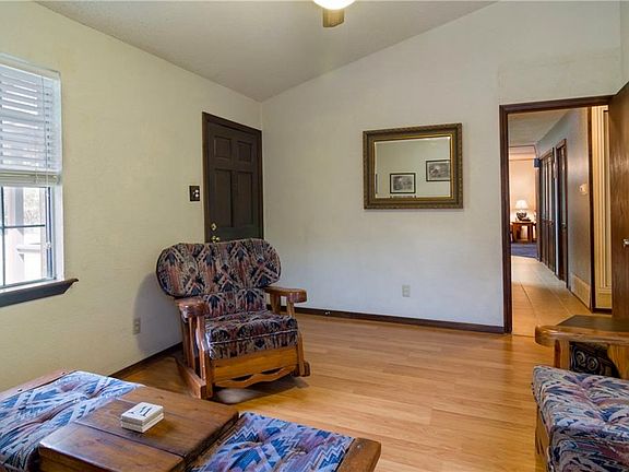 Another view of the living room and the door on the right leads to the hallway and the rest of the home.