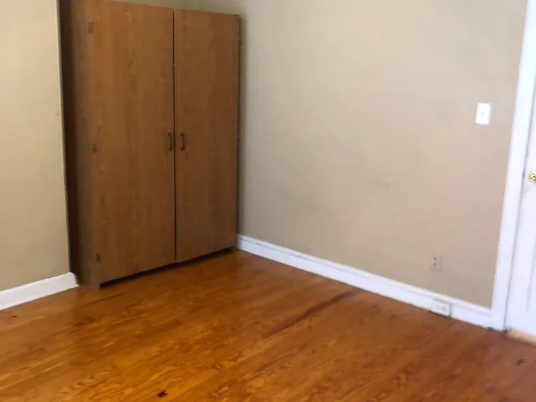 Third floor bedroom features a large closet, a separate kitchen, and a private full bath