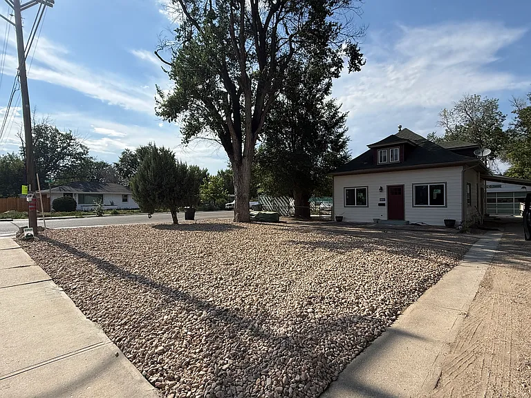 New landscaping in front of the freshly painted house.