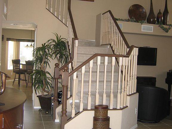 ENTRY WAY LEADING TO DRAMATIC STAIRCASE