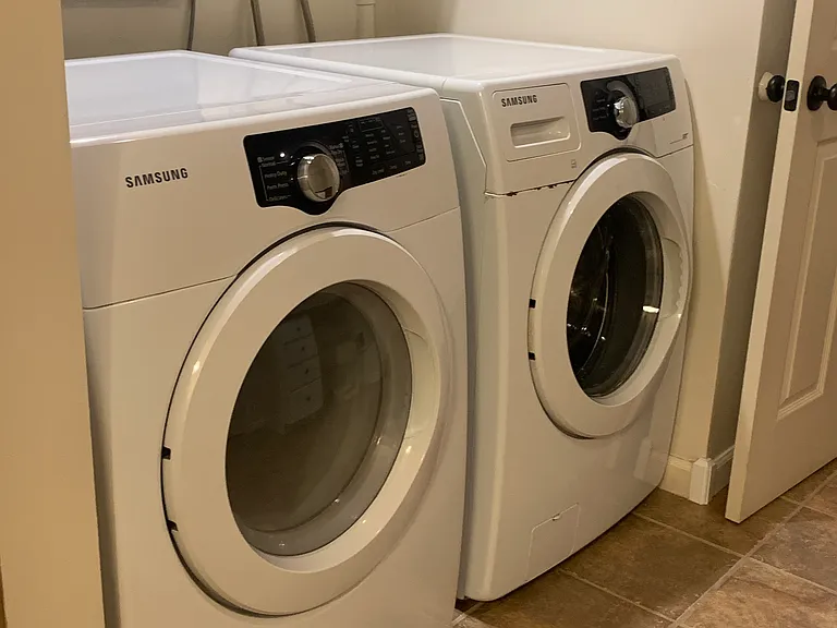 roomy bathroom with washer and dryer
