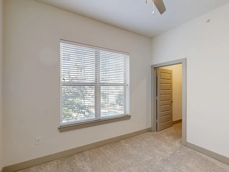 Spacious apartment Bedroom with Carpet Floor.