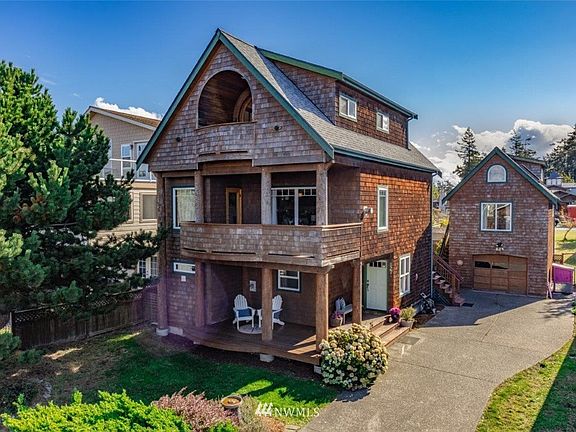 This is the builders own custom home. Design after ski chalets in Canada. The third floor is the master suit with unobstructed water views. 