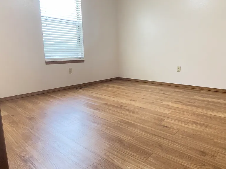 This 2nd Bedroom is located at the end of the hallway and to the right.